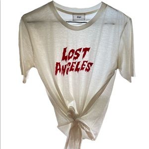 A T with Lost Angeles logo